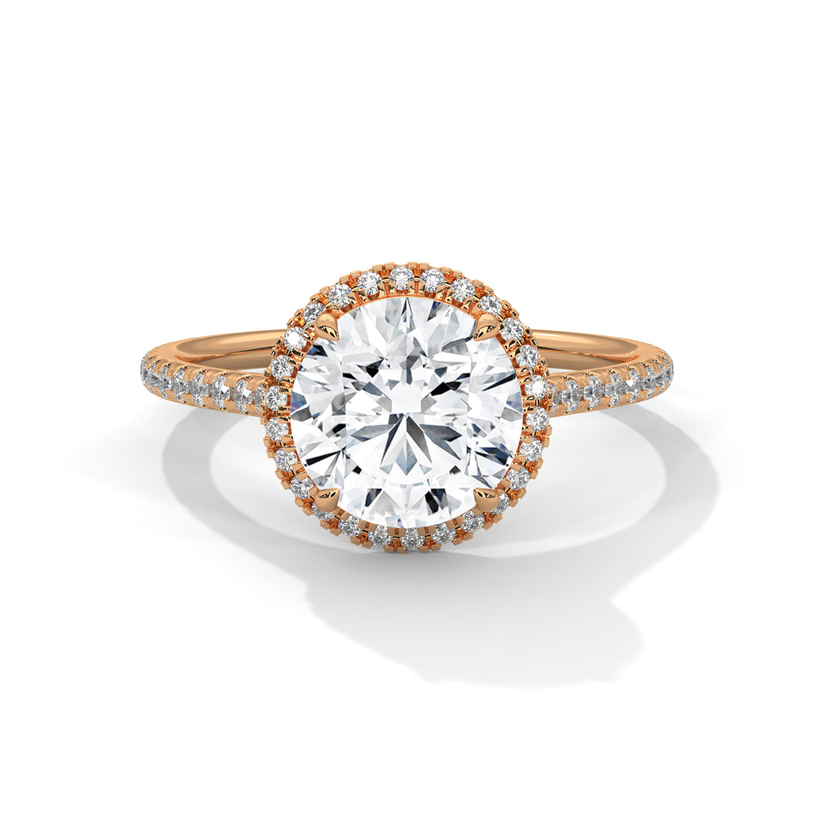 Round halo engagement ring with prong-set center stone, warm yellow gold tone and pavé band