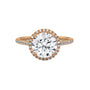 Round halo engagement ring with prong-set center stone, warm yellow gold tone and pavé band