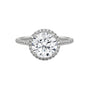 Round halo engagement ring with prong-set center stone, white metal and pavé diamond halo