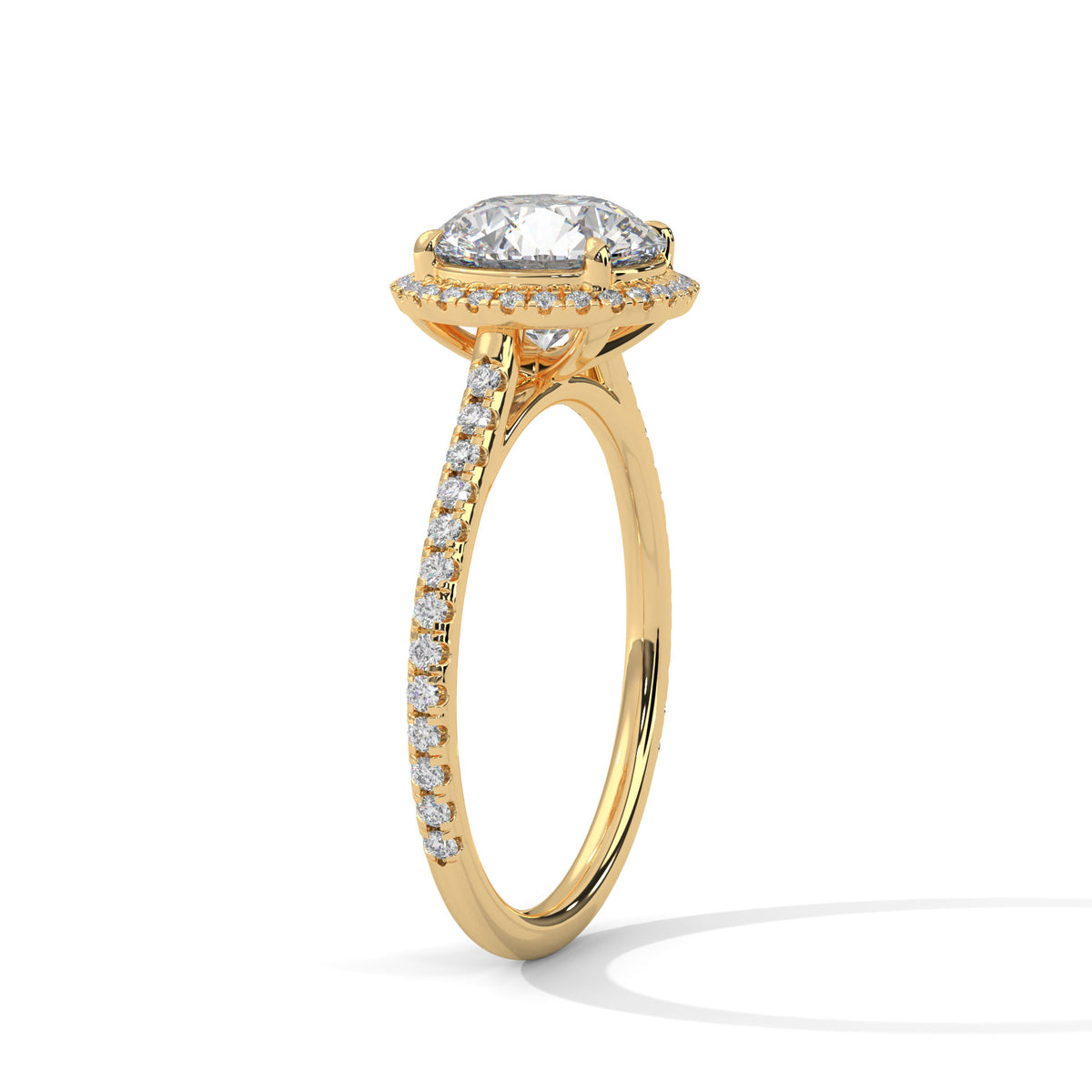 Round halo engagement ring with prong-set center stone, yellow gold tone and pavé band