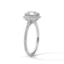 Round halo engagement ring with prong-set center stone, bright white metal and pavé band
