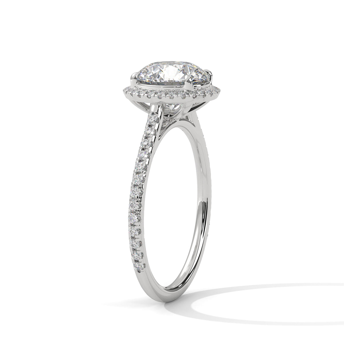 Round halo engagement ring with prong-set center stone, bright white metal and pavé band