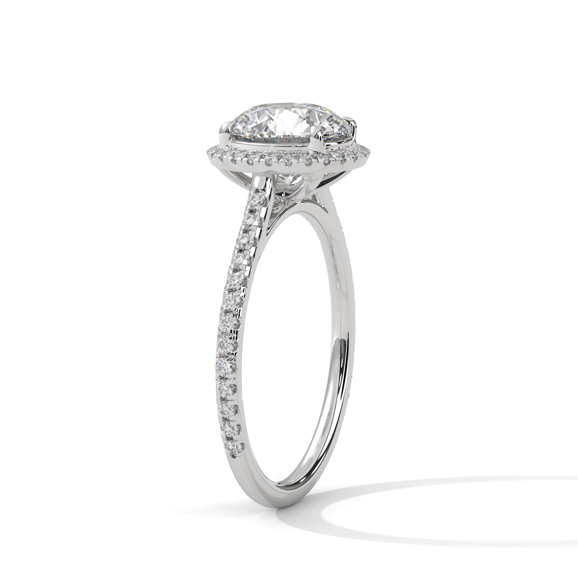 Round halo engagement ring with prong-set center stone, bright white metal and pavé band