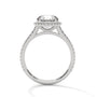 Round halo engagement ring with prong-set center stone, white metal and pavé details