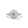 Round halo diamond ring with large round center stone and pavé band, yellow gold