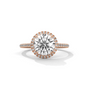 Round halo diamond ring with large round center stone and pavé band, rose gold