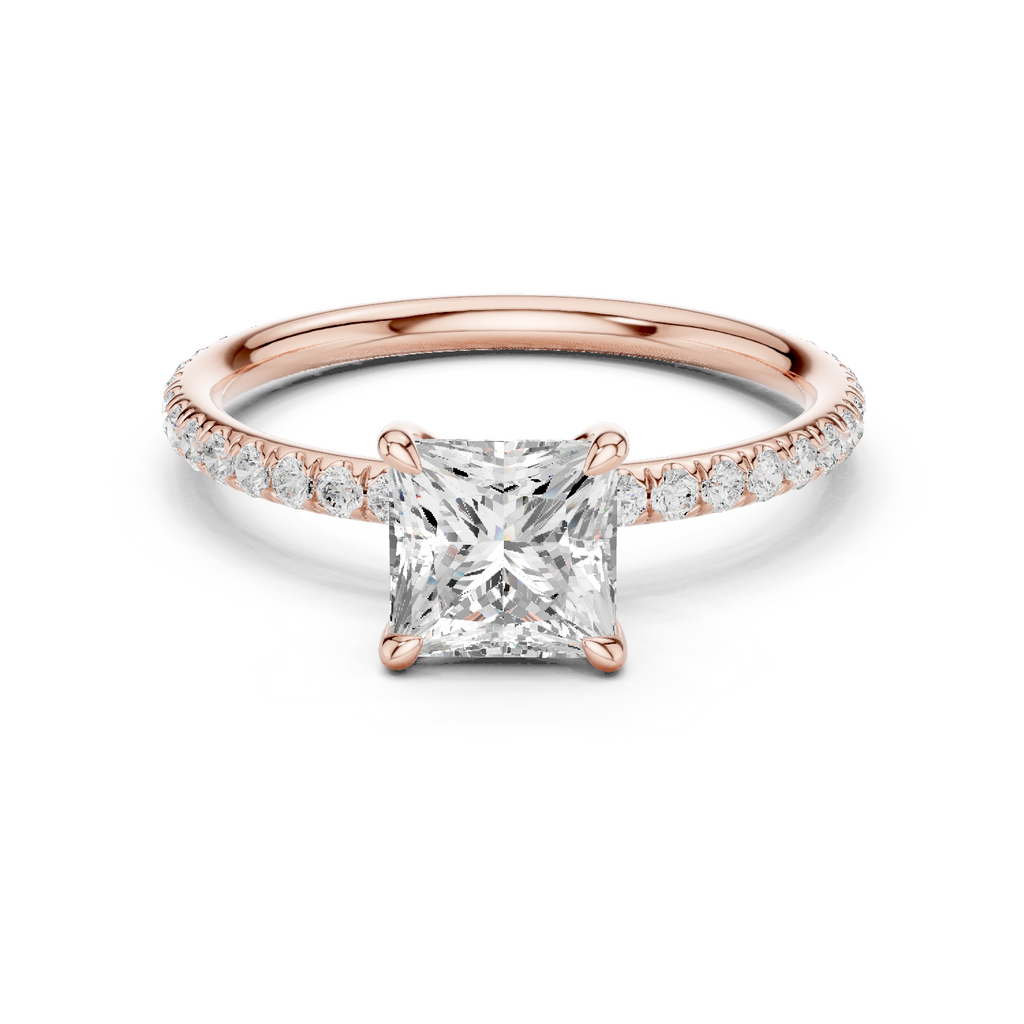 Rose gold solitaire engagement ring with princess center stone and diamond side band