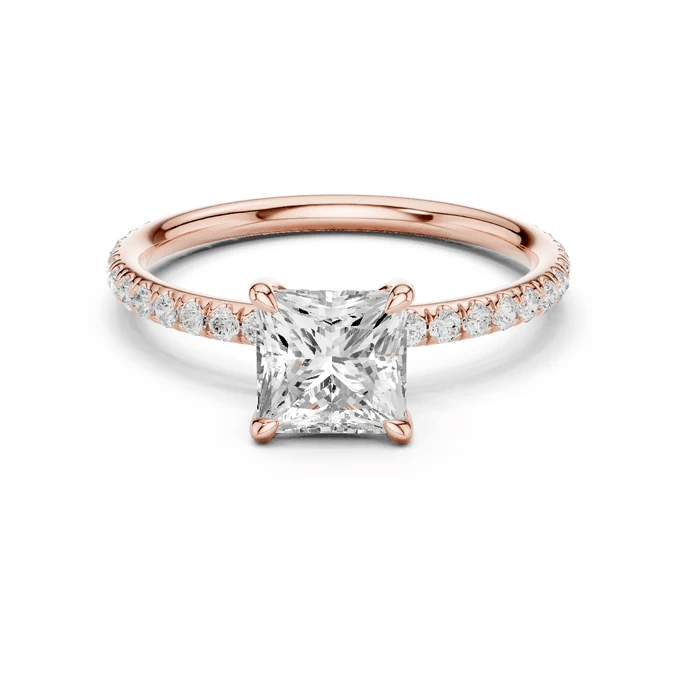 Rose gold princess-cut solitaire diamond ring with pavé band and four-prong center setting