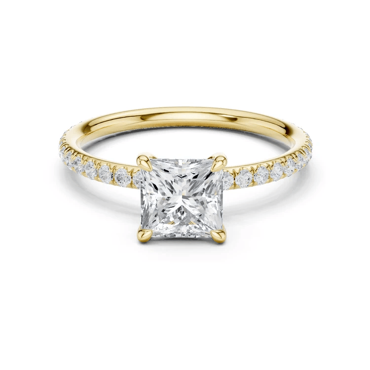 Yellow gold princess-cut solitaire diamond ring with pavé band and four-prong center setting
