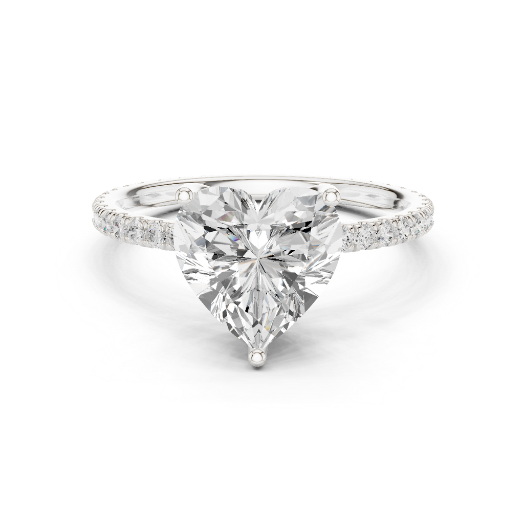 White gold heart-cut diamond solitaire ring with pavé band and prong-set center