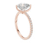 Rose gold heart-cut diamond ring with pavé side stones and heart-shaped center