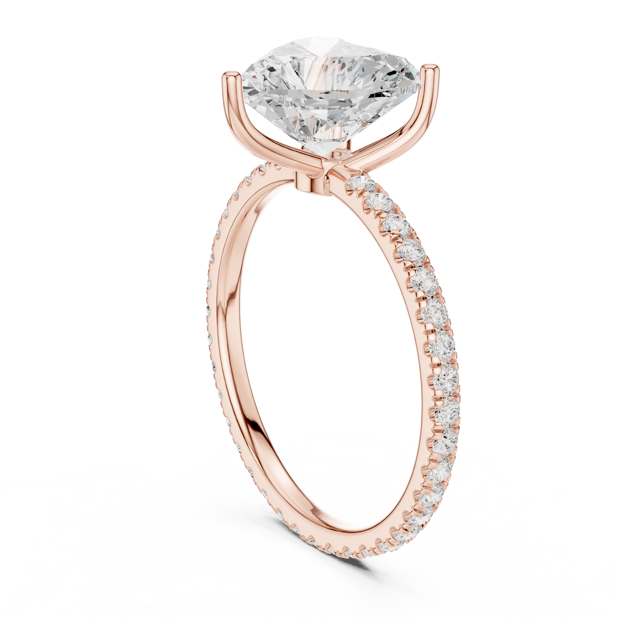 Rose gold heart-cut diamond ring with pavé side stones and heart-shaped center