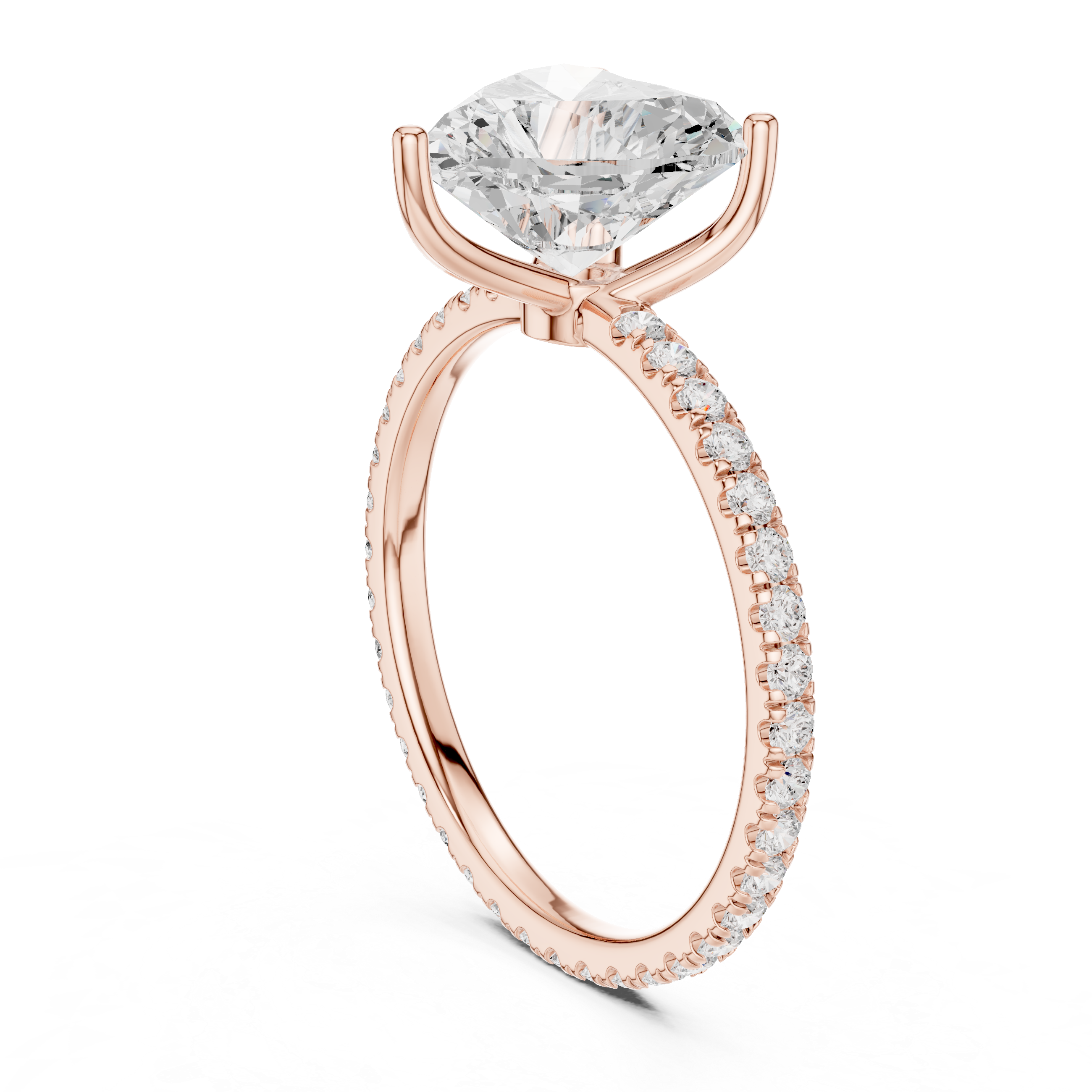 Rose gold heart-cut diamond engagement ring with pavé band and prong-set center