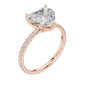 Rose gold heart-cut diamond ring with pavé band and prong-set heart center, angle view
