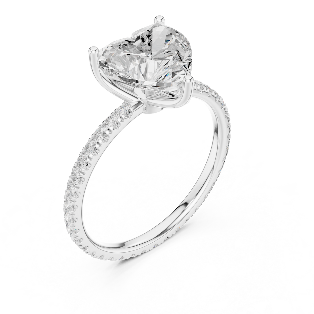 White gold heart-cut diamond solitaire ring with pavé band and prong-set center