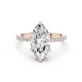 Rose gold pear-shaped gemstone ring with pave band and prong setting