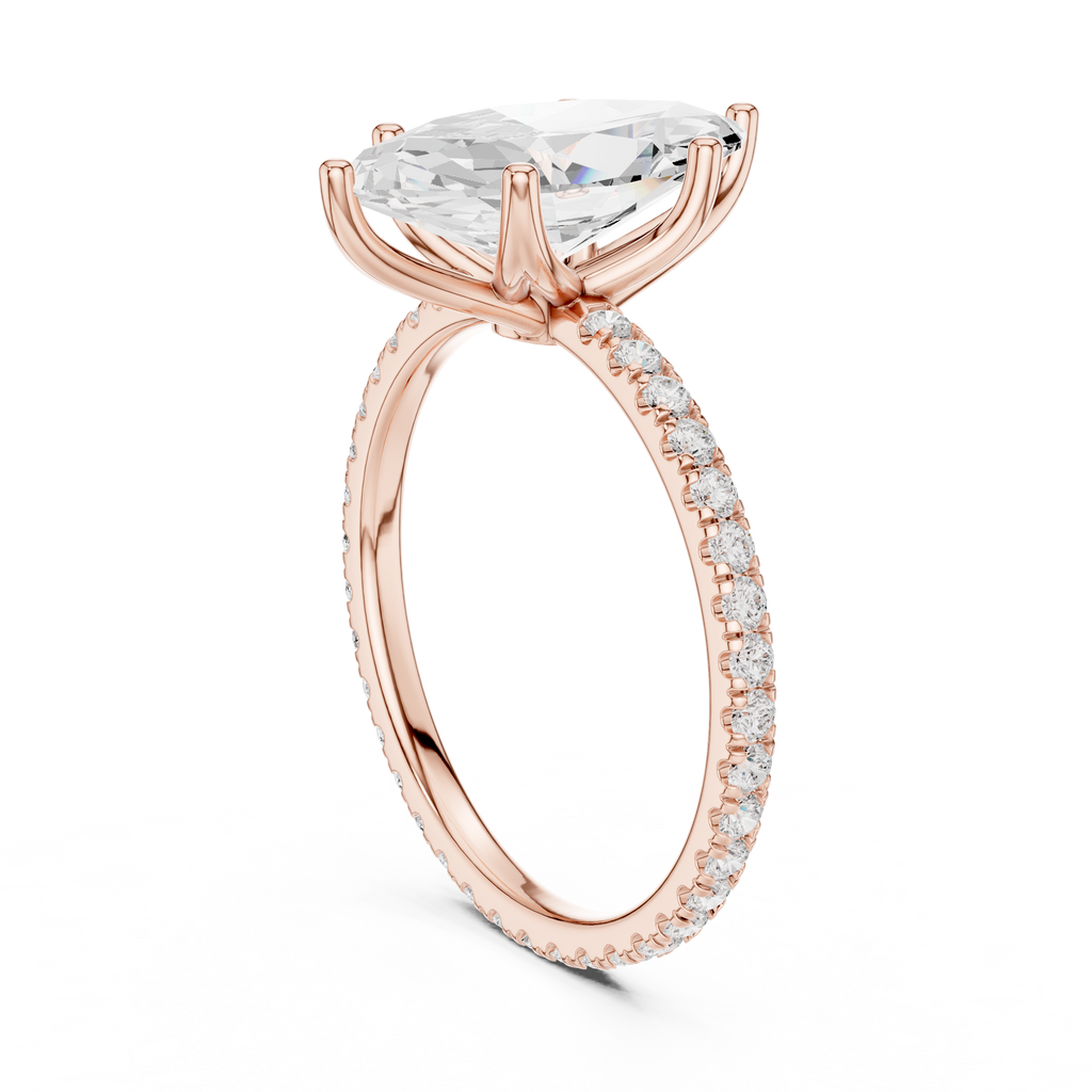 Rose gold oval gemstone ring with pave detail and prong setting