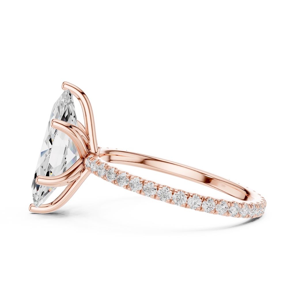 Rose gold oval gemstone ring with pave band and split-prong design