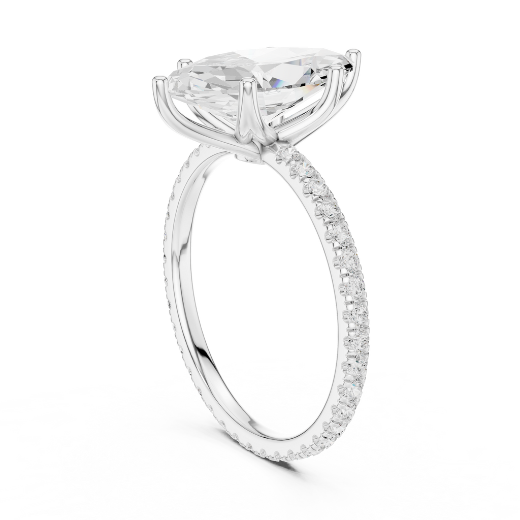 White gold oval gemstone ring with pave shank and prong setting
