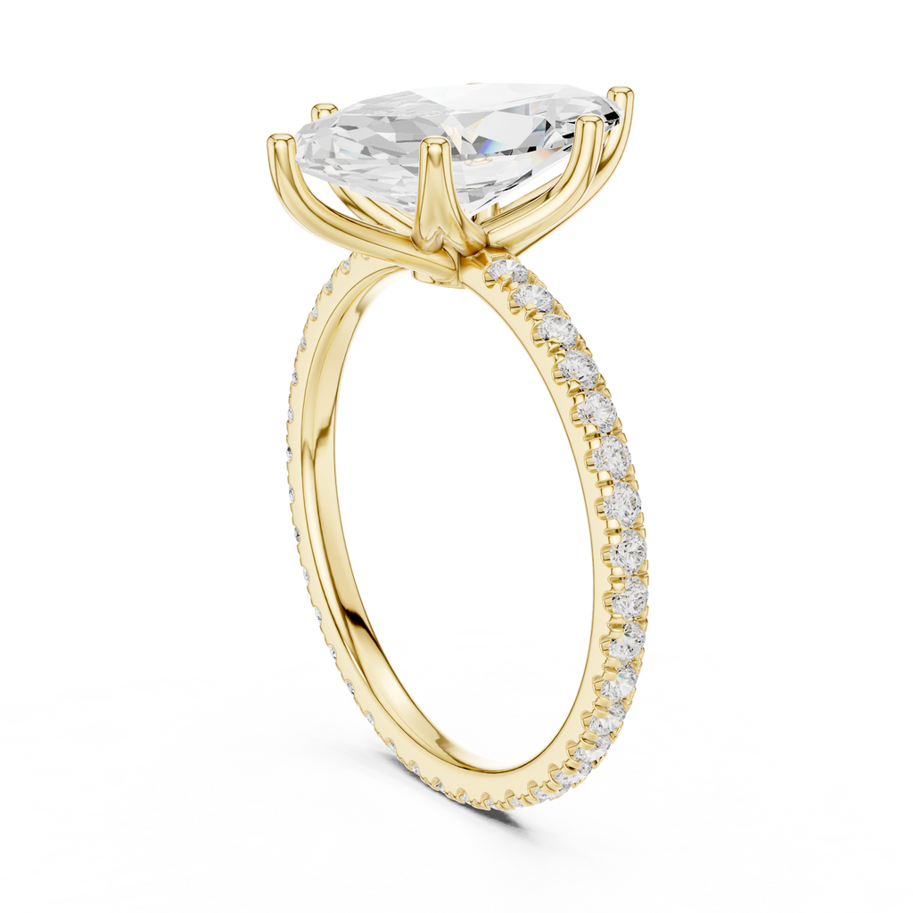 Gold-tone gemstone ring with prong-set pear-cut center and pavé side band