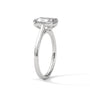 White gold solitaire engagement ring with emerald-cut center stone and trellis-style prongs