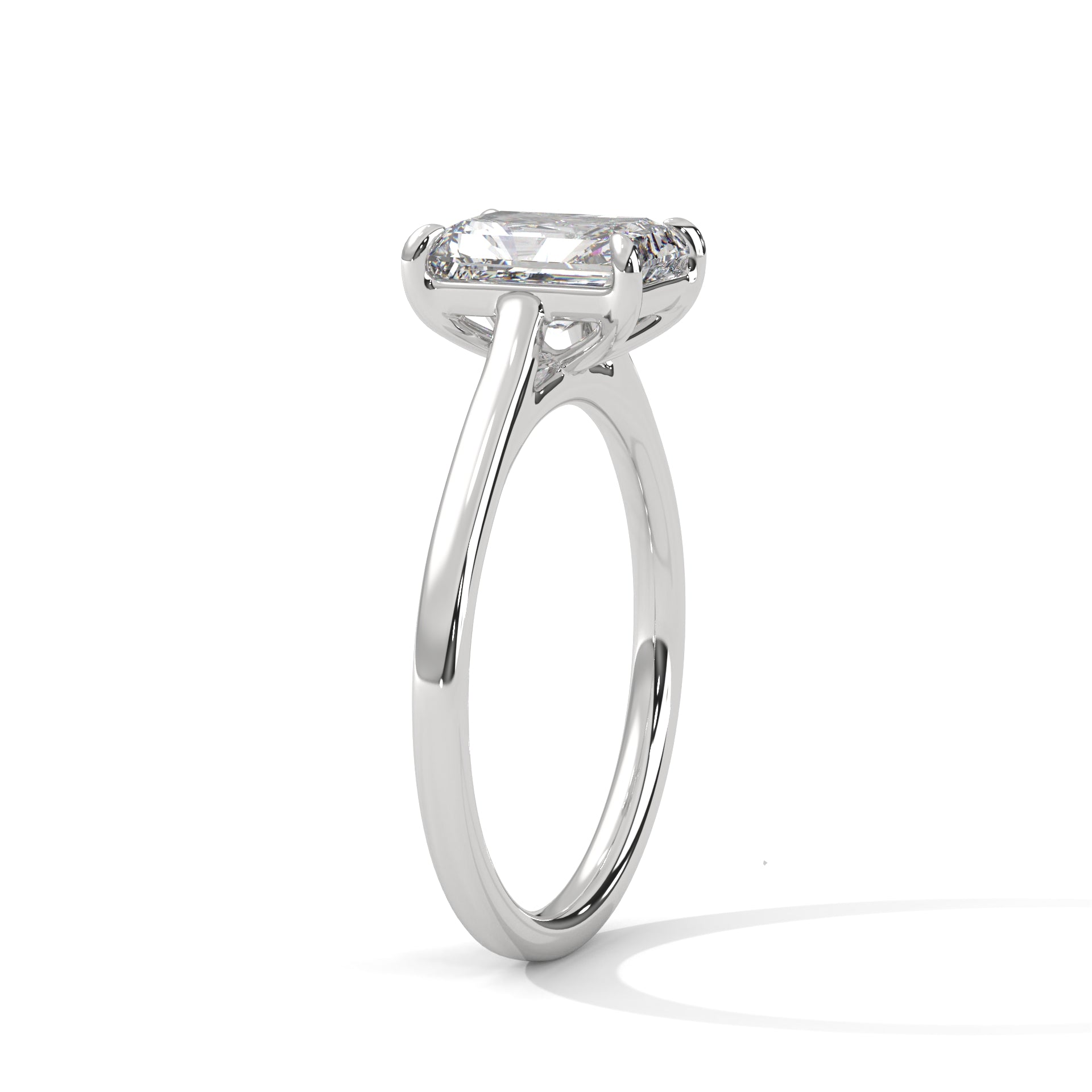 White gold solitaire engagement ring with emerald-cut center stone and trellis-style prongs