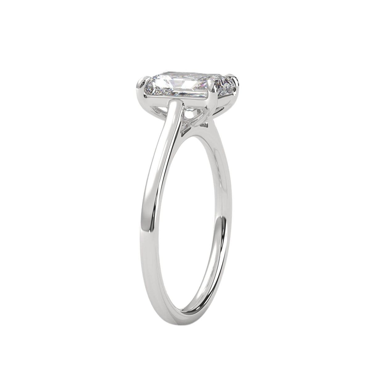 White gold solitaire engagement ring with emerald-cut center stone and trellis-style prongs