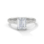 Platinum solitaire engagement ring with emerald-cut center stone in four-prong trellis setting
