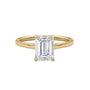 Yellow gold solitaire engagement ring with emerald-cut center stone in four-prong trellis setting