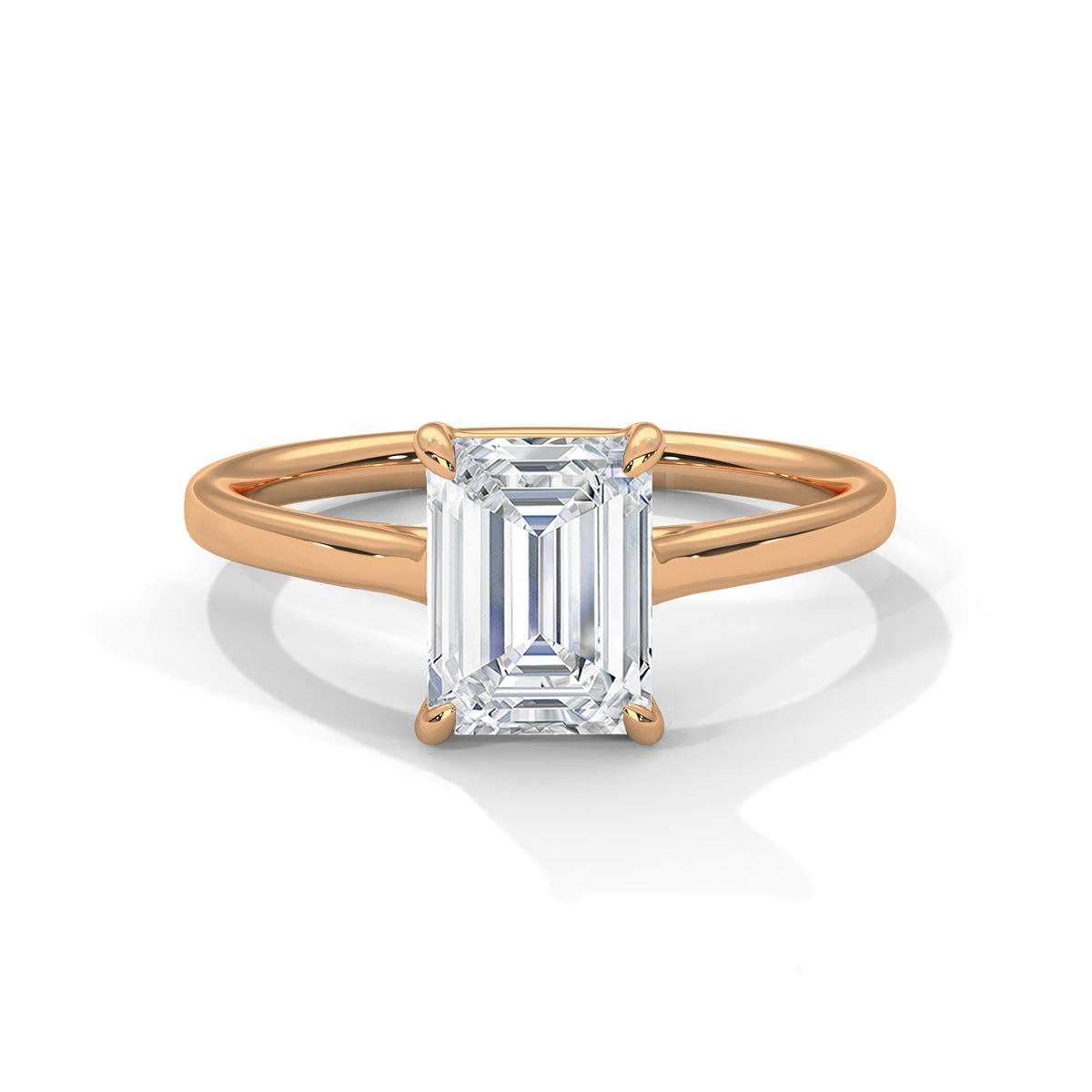 Rose gold solitaire engagement ring with emerald-cut center stone in four-prong trellis setting
