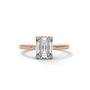 Diamond solitaire ring with emerald-cut center stone and four-prong setting, rose gold