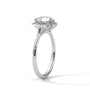 Platinum engagement ring with round center stone and floral halo, side view.