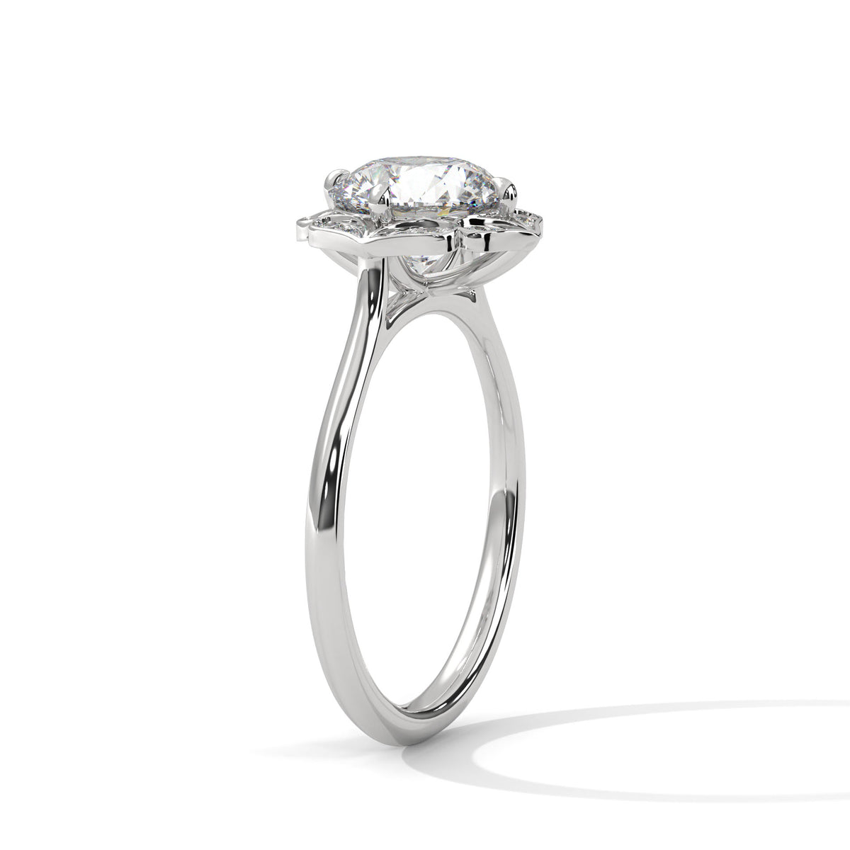 Platinum engagement ring with round center stone and floral halo, side view.