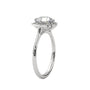 Platinum engagement ring with round center stone and floral halo, side view.