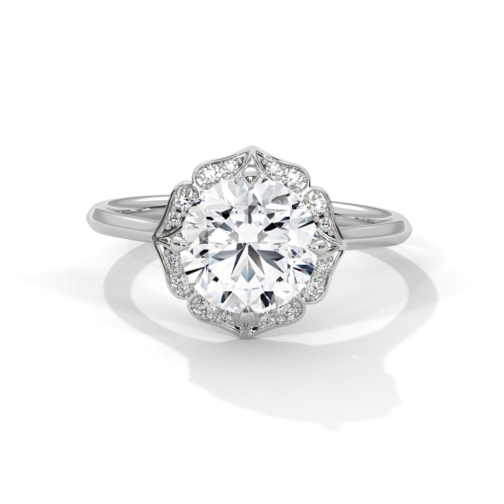White gold round halo engagement ring with prong-set center stone, 3/4 view.