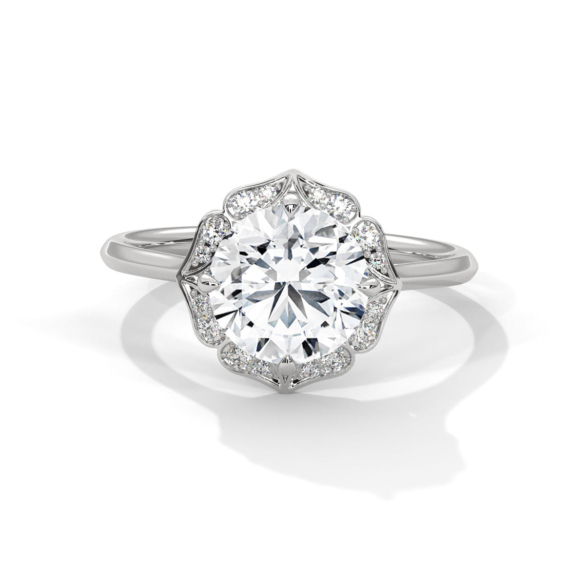White gold round halo engagement ring with prong-set center stone, 3/4 view.
