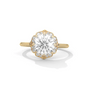 Round diamond halo ring with large center stone, yellow gold band and side diamonds