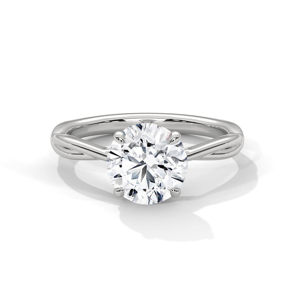 Silver solitaire ring with round clear diamond center and split band with curved grooves