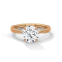 Twisted solitaire diamond ring in yellow gold with round prong-set diamond