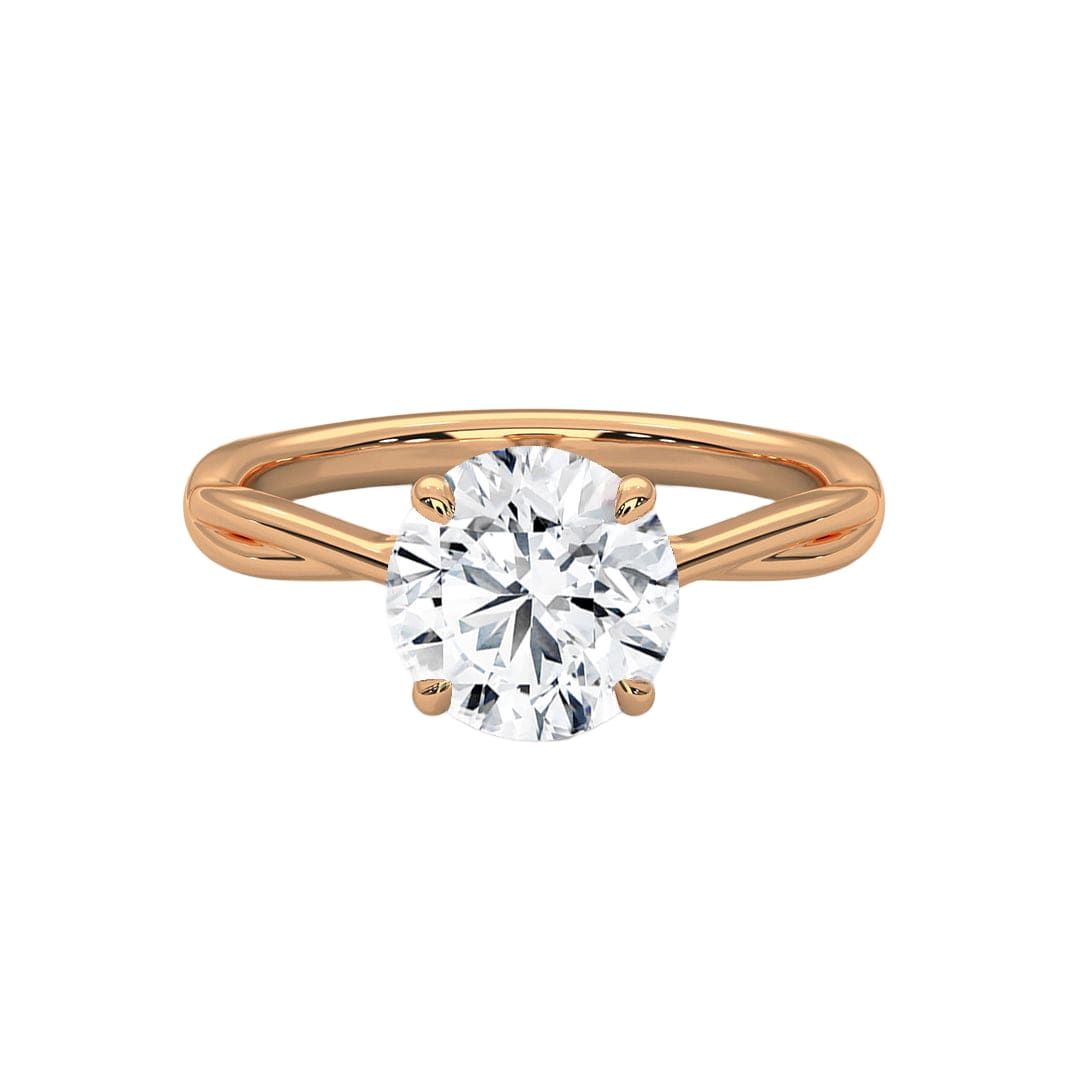 Twisted solitaire diamond ring in yellow gold with round prong-set diamond