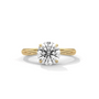Twisted solitaire diamond ring in yellow gold with round center diamond