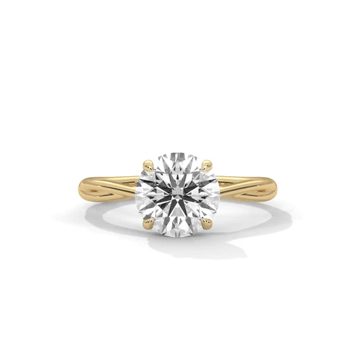 Twisted solitaire diamond ring in yellow gold with round center diamond