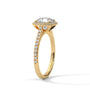 Cushion halo diamond ring side view with pavé stones and prong-set cushion center in gold